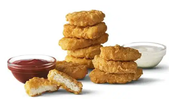 McDonald's 10-piece Chicken McNuggets with crispy, golden breading served with a choice of dipping sauces