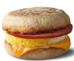 McDonald's Egg McMuffin with bacon, a soft English muffin, a fresh egg, melted cheese, and crispy bacon