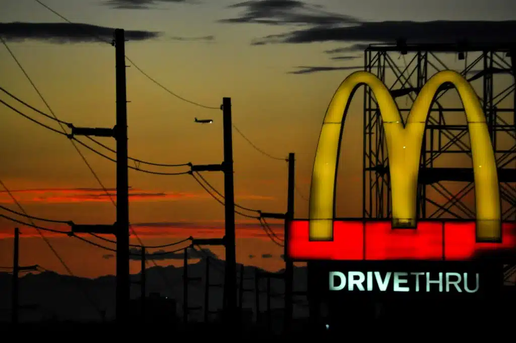 McDonald's restaurant front board with iconic golden arches logo.