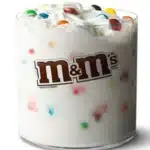 McDonald's McFlurry with M&M's Candies, a creamy vanilla soft-serve ice cream mixed with colorful M&M's chocolate candies