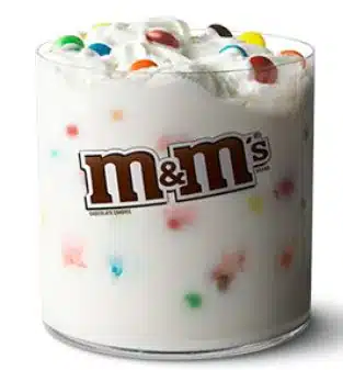 McDonald's McFlurry with M&M's Candies, a creamy vanilla soft-serve ice cream mixed with colorful M&M's chocolate candies