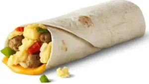 McDonald's Sausage Burrito wrapped in a soft tortilla with scrambled eggs, sausage, cheese, and diced vegetables