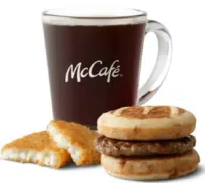 McDonald's Sausage McGriddles Meal with sweet griddle cakes, crispy hash brown, and hot coffee.