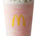 McDonald's Strawberry Shake, a creamy milkshake made with sweet strawberry flavor and topped with whipped cream