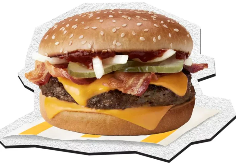 McDonald's Limited-Time BBQ Bacon Quarter Pounder with Cheese, featuring a beef patty, crispy bacon, melted cheese, pickles, onions, and BBQ sauce on a sesame seed bun.